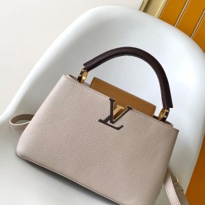 p125031.05 x 20.0 x 11.0 cm (L x H x W)27.0 x 17.3 x 9.0 cm (L x H x W)21.0 x 13.6 x 8.0 cm (L x H x W)•Taurillon calf leather•Calf leather trim•Cowhide leather lining•Metal hardware•Flap can be positioned inside or outside•Zippered interior pocket•Interior slip pocket•Metal studs•Holds smartphone, LV Vertical wallet, headphones, and keys•Shoulder strap: Detachable, adjustable•Strap length: 45.5 cm•Adjustable to: 53.0 cm•Handle: Single handle